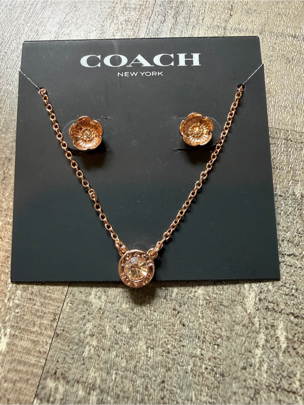 COACH Open Circle Necklace and Tea Rose Stud Set.